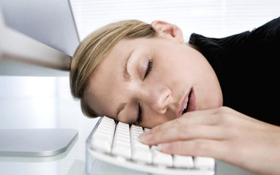 Woman Sleeping on Computer Keyboard